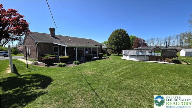 view of yard with a covered pool