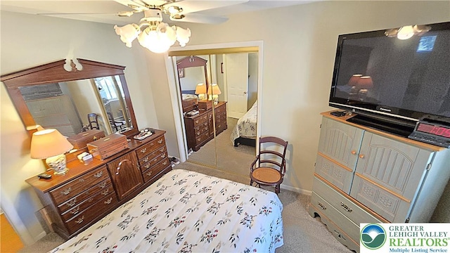 bedroom with carpet flooring, baseboards, and ceiling fan