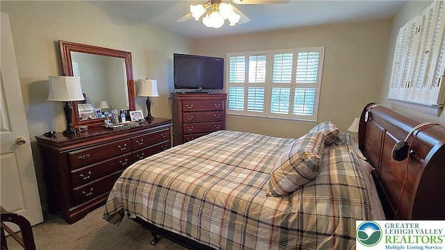carpeted bedroom with a ceiling fan