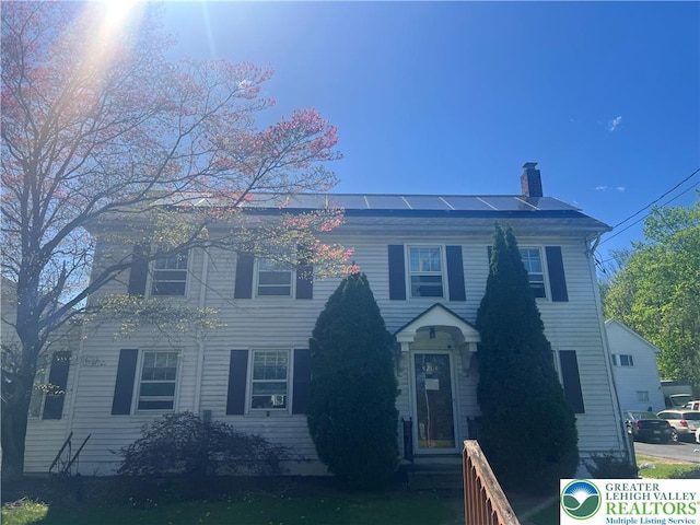 8204 Brown St, Washington Twp, PA 18079 - colonial home with a chimney and solar panels