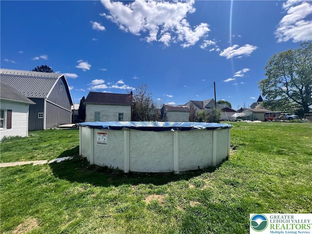 8204 Brown St, Washington Twp, PA 18079 - view of swimming pool featuring a yard and a covered pool