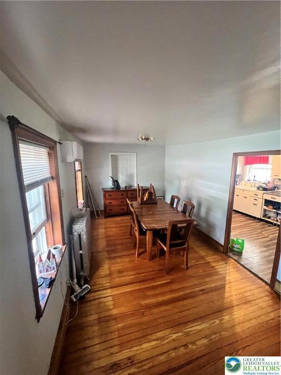 8204 Brown St, Washington Twp, PA 18079 - dining room with a wealth of natural light, radiator, and hardwood / wood-style floors