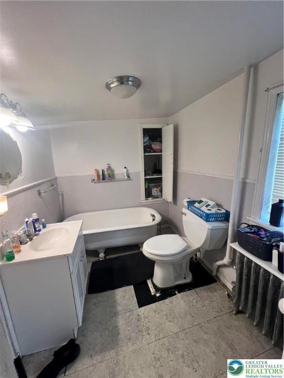 8204 Brown St, Washington Twp, PA 18079 - bathroom with vanity, a freestanding bath, and toilet