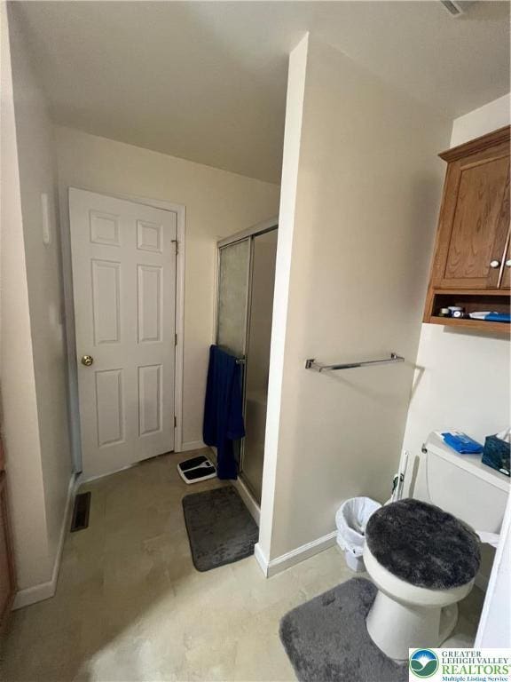 8204 Brown St, Washington Twp, PA 18079 - bathroom featuring baseboards, a stall shower, visible vents, and toilet