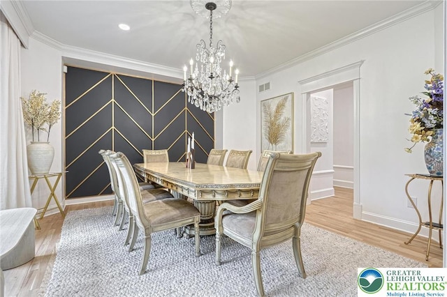 1231 Oakside Dr, Hanover Twp, PA 18017 - dining room featuring visible vents, baseboards, light wood finished floors, an inviting chandelier, and ornamental molding