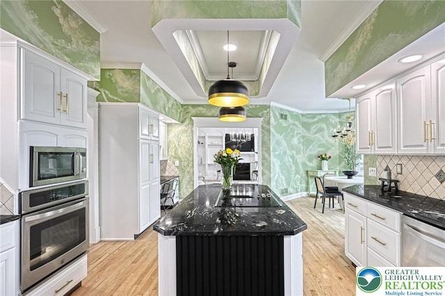 1231 Oakside Dr, Hanover Twp, PA 18017 - kitchen with light wood-style floors, dark stone countertops, stainless steel appliances, and wallpapered walls