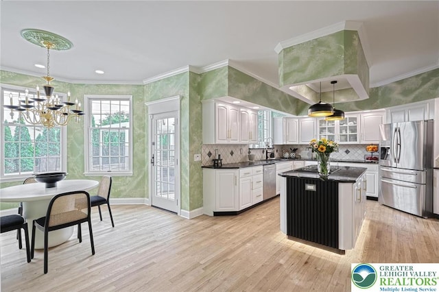 1231 Oakside Dr, Hanover Twp, PA 18017 - kitchen featuring an inviting chandelier, dark countertops, light wood-style floors, white cabinets, and appliances with stainless steel finishes