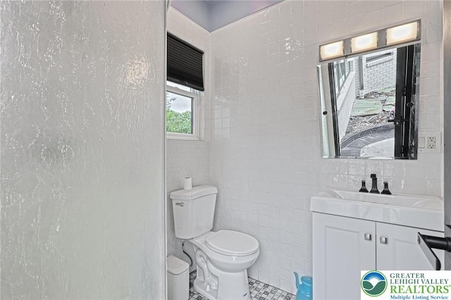 1231 Oakside Dr, Hanover Twp, PA 18017 - bathroom with tile walls, tile patterned flooring, vanity, and toilet