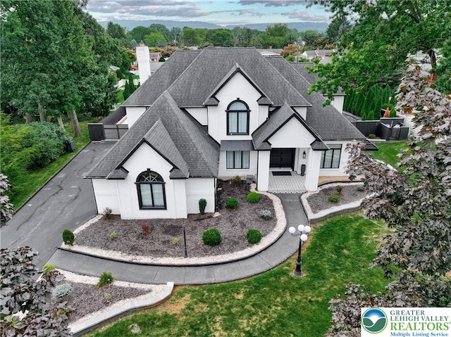 1231 Oakside Dr, Hanover Twp, PA 18017 - french provincial home with a chimney, roof with shingles, and a front lawn