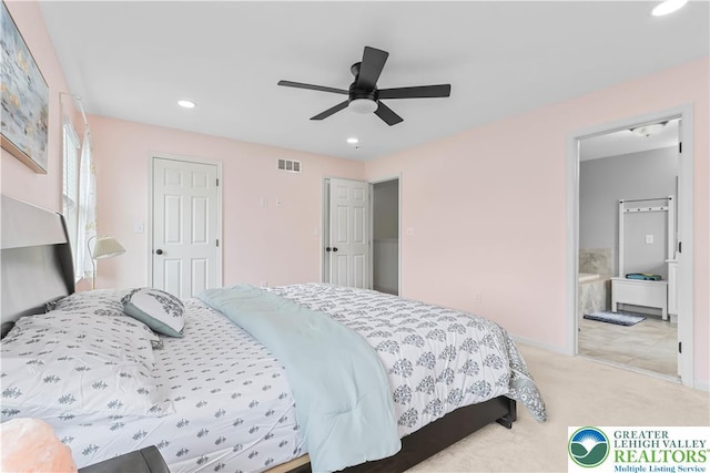 carpeted bedroom featuring ceiling fan, visible vents, baseboards, connected bathroom, and recessed lighting