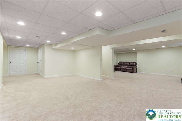 finished below grade area with carpet floors, recessed lighting, baseboards, a drop ceiling, and visible vents