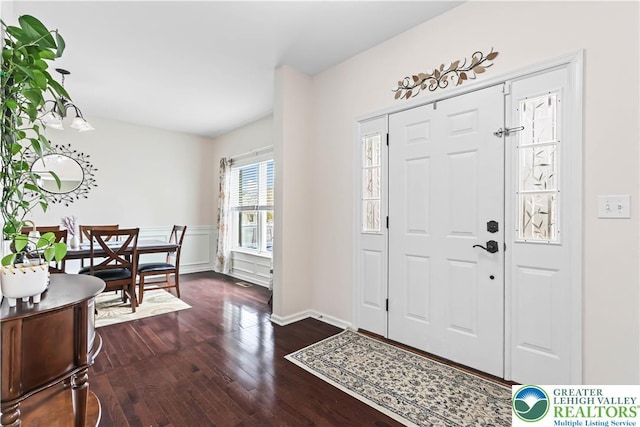 foyer with dark wood-style floors