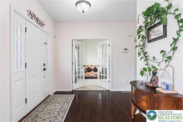 entryway featuring baseboards, french doors, and wood finished floors