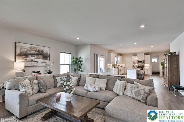 living room featuring recessed lighting and wood finished floors