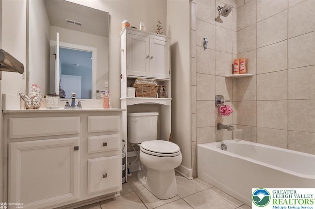 full bathroom featuring vanity, visible vents, toilet, tile patterned floors, and shower / bath combination