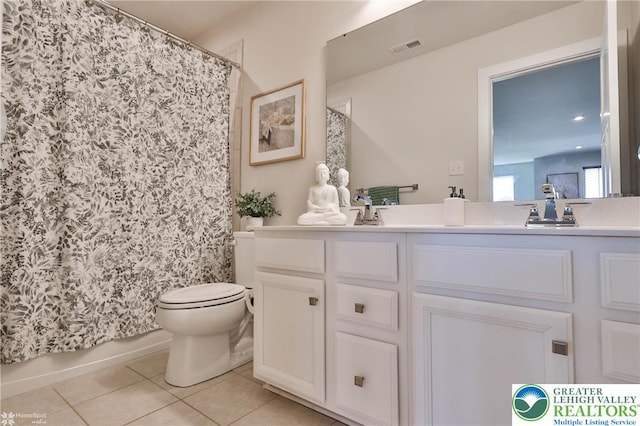 bathroom featuring double vanity, toilet, tile patterned floors, a shower with shower curtain, and visible vents