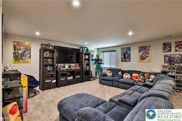 carpeted living area featuring recessed lighting and visible vents