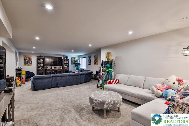 carpeted living room with recessed lighting and visible vents