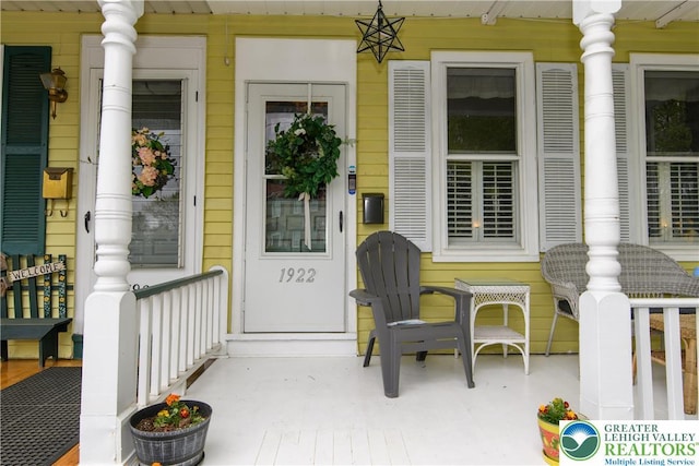 doorway to property with a porch