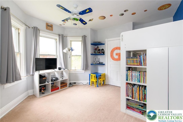 playroom with baseboards and carpet