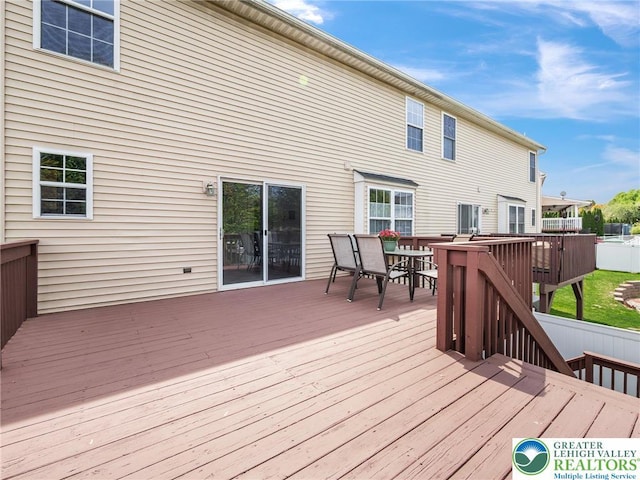 deck featuring outdoor dining area
