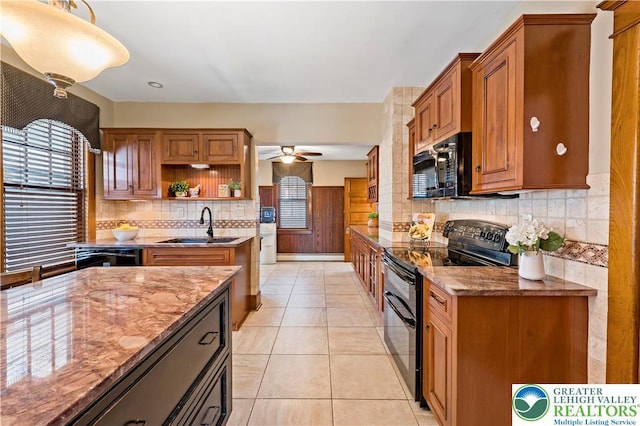 kitchen featuring light stone countertops, open shelves, a sink, backsplash, and black appliances