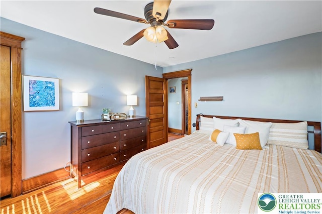 bedroom with baseboards and ceiling fan