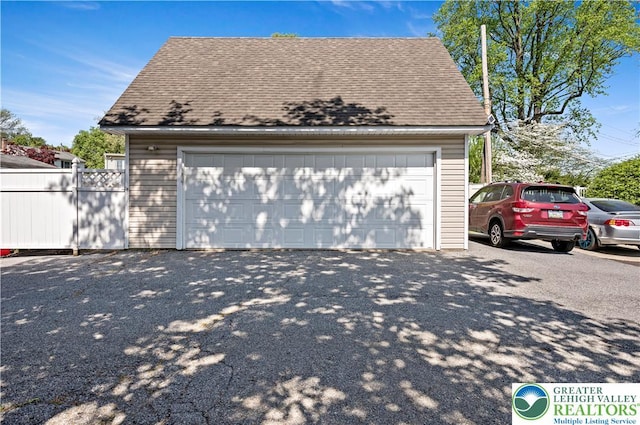 detached garage with fence