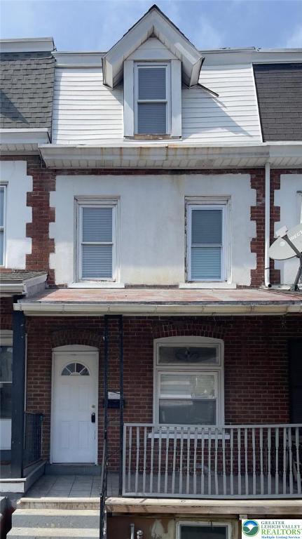 1541 W Tilghman St, Allentown City, PA 18102 - townhome / multi-family property featuring a porch and brick siding