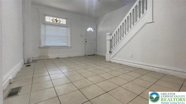 1541 W Tilghman St, Allentown City, PA 18102 - entryway with visible vents, baseboards, light tile patterned flooring, and stairway