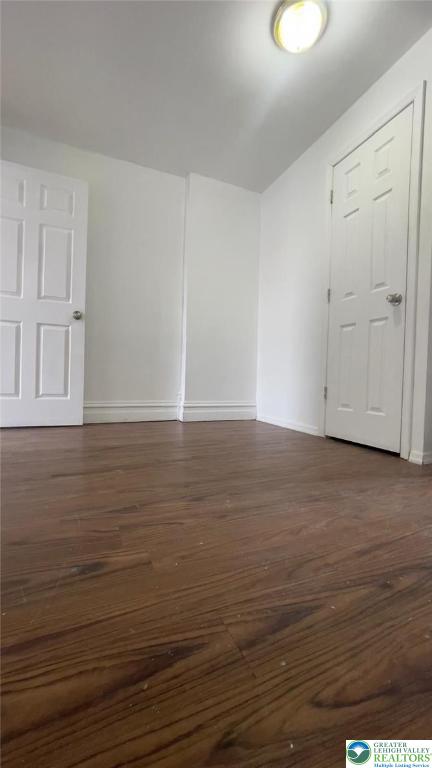 1541 W Tilghman St, Allentown City, PA 18102 - unfurnished room with baseboards and dark wood-style floors