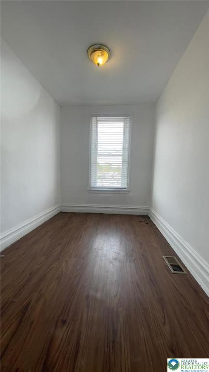 1541 W Tilghman St, Allentown City, PA 18102 - unfurnished room with dark wood-style flooring, baseboards, and visible vents