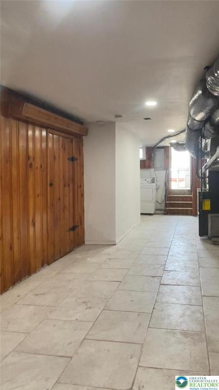 1541 W Tilghman St, Allentown City, PA 18102 - below grade area featuring wooden walls, heating unit, and washer and dryer