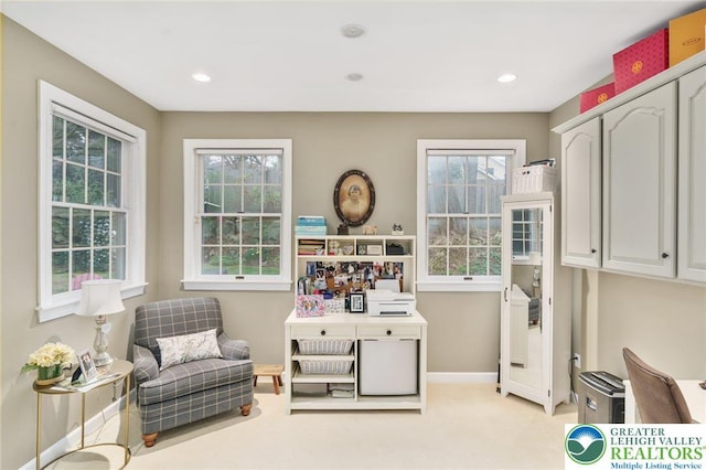 living area featuring recessed lighting, baseboards, plenty of natural light, and light carpet