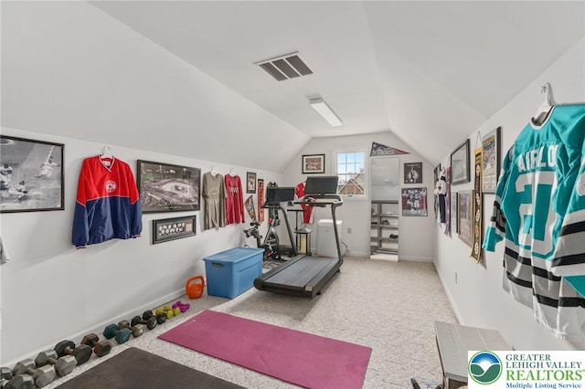 workout area featuring visible vents, carpet, and lofted ceiling