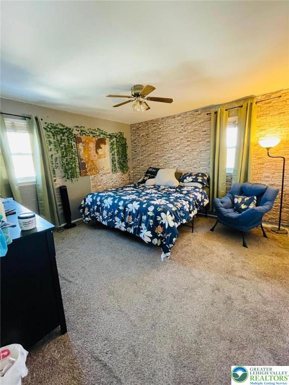 bedroom featuring carpet floors and a ceiling fan
