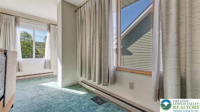 details with a baseboard radiator and carpet