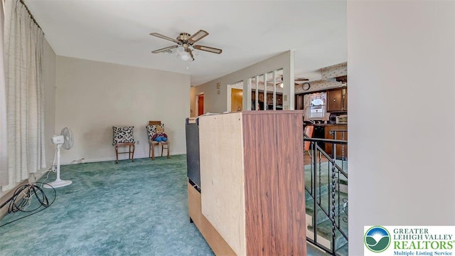 interior space with carpet floors and an upstairs landing