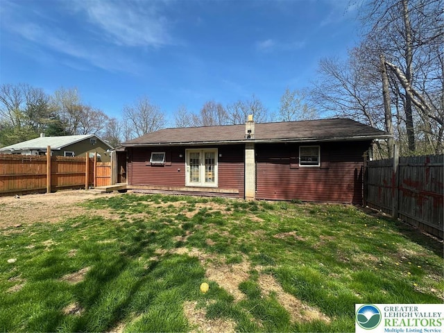 1165 E Catawissa St, Nesquehoning Borough, PA 18240 - back of property featuring a lawn, a fenced backyard, and french doors