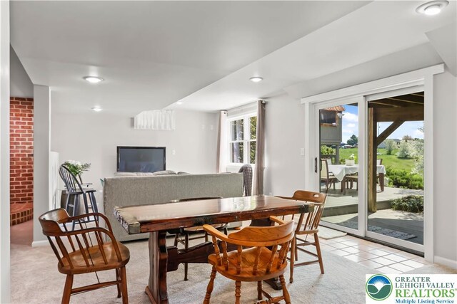 dining room featuring recessed lighting, baseboards, and light colored carpet