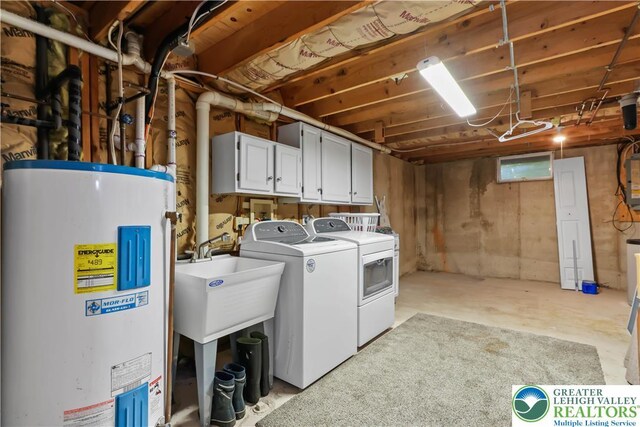 laundry area with cabinet space, independent washer and dryer, and electric water heater