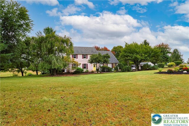 view of front of home with a front yard