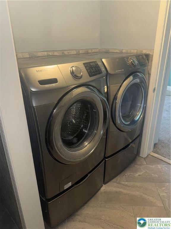 laundry area with laundry area and washing machine and dryer