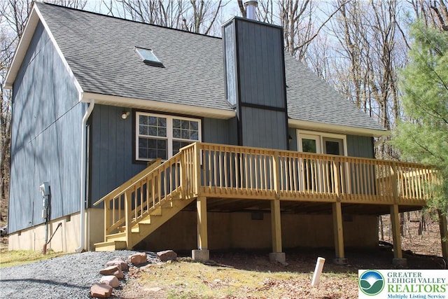 95 Piney Woods Dr, Penn Forest Township, PA 18229 - rear view of property with a shingled roof and a wooden deck