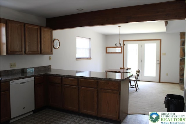 95 Piney Woods Dr, Penn Forest Township, PA 18229 - kitchen with carpet flooring, a peninsula, dishwasher, and a healthy amount of sunlight