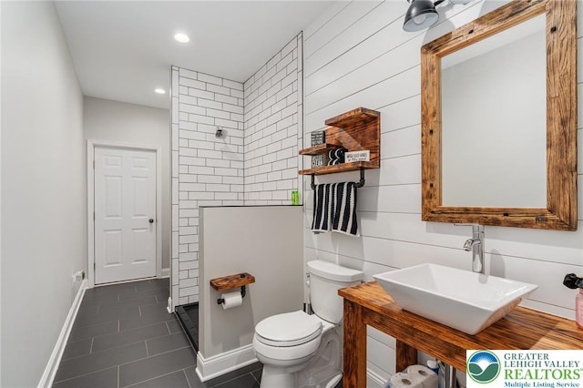4164 Tank Farm Rd, Upper Milford Twp, PA 18049 - full bath featuring a tile shower, tile patterned flooring, toilet, recessed lighting, and baseboards