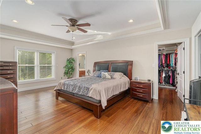 4164 Tank Farm Rd, Upper Milford Twp, PA 18049 - bedroom with a tray ceiling, ornamental molding, a walk in closet, and hardwood / wood-style flooring