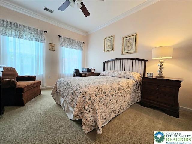 bedroom with crown molding, carpet floors, baseboards, and visible vents