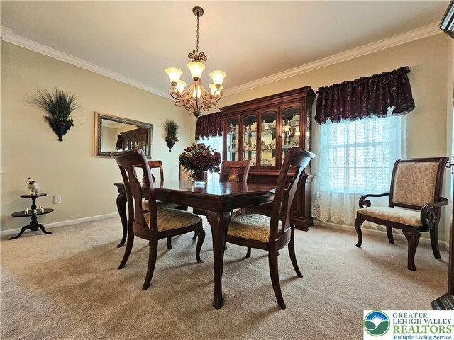 dining space with an inviting chandelier, ornamental molding, baseboards, and light carpet