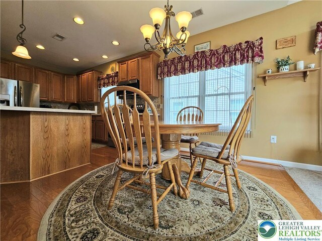 dining space featuring recessed lighting, baseboards, a chandelier, and visible vents